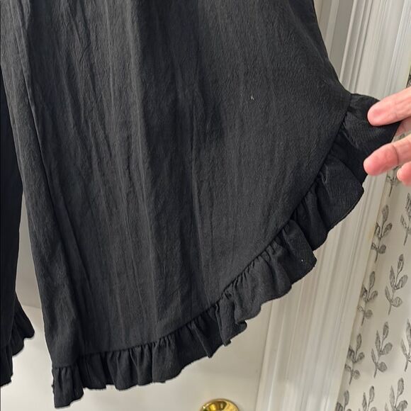 Black Ruffle Hem Wide-Leg Gaucho Pants. Elastic waist and ruffle hemline - Picture 2 of 11